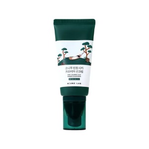 ROUND LAB Pine Calming Cica Primer Sunscreen 50ml in a portable tube for smooth skin texture.