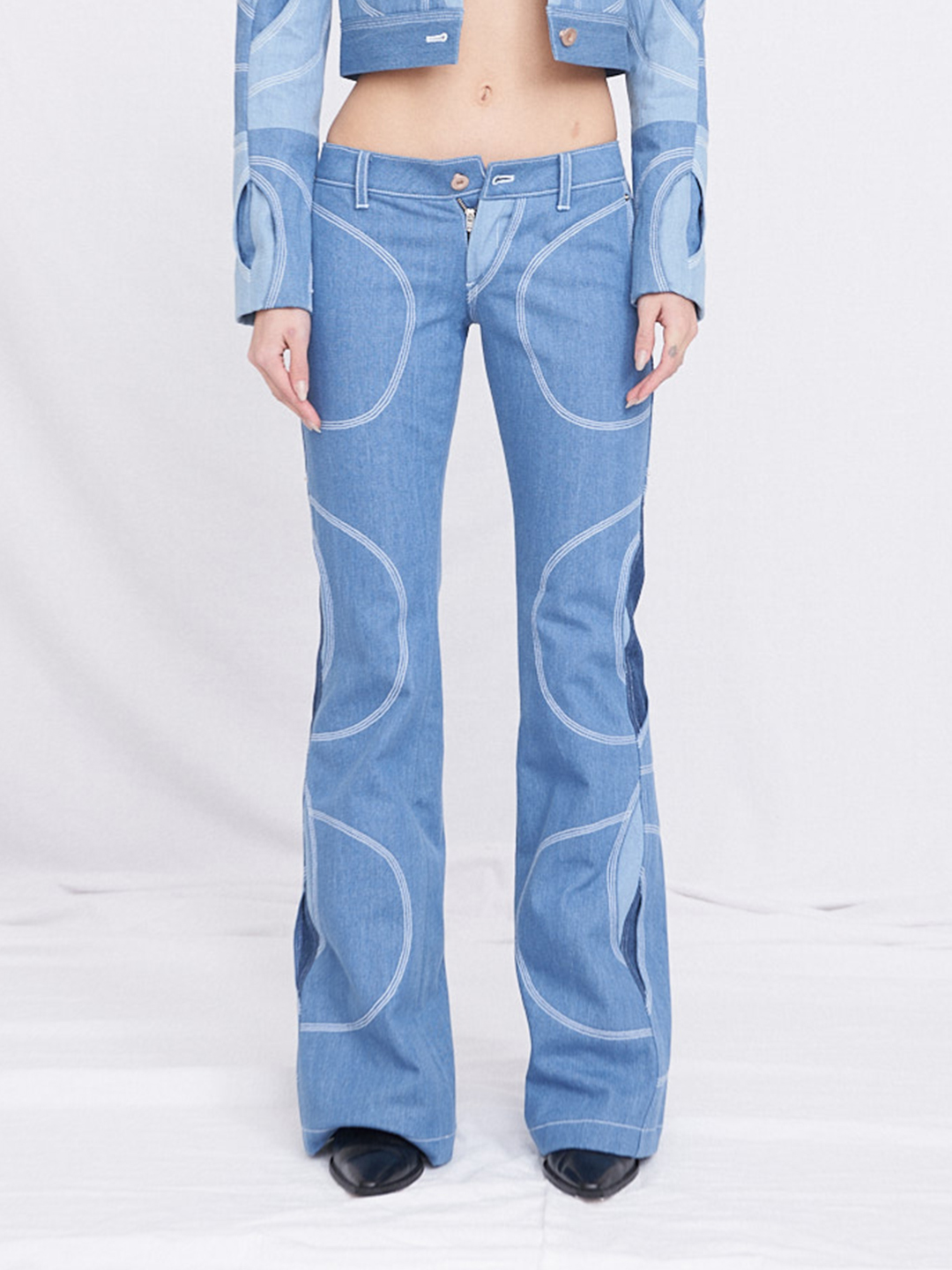 Circular layered row-rise bootcut jeans