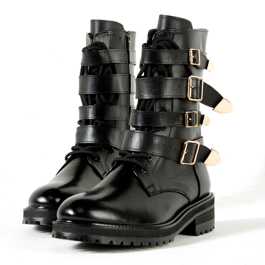 Gold buckle belted black boots