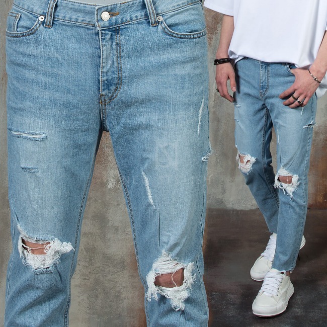Distressed ripped blue denim jeans
