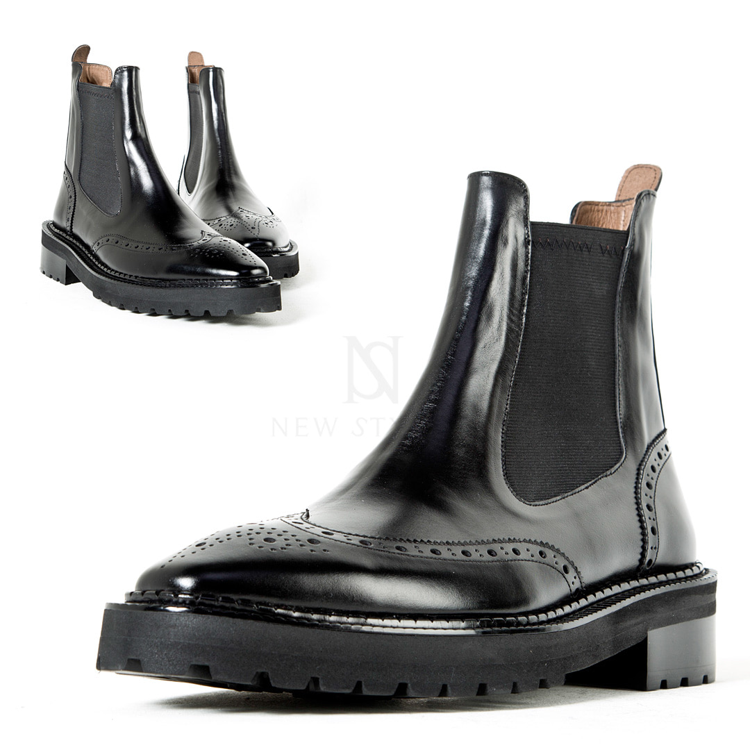 Wing-tip chelsea boots