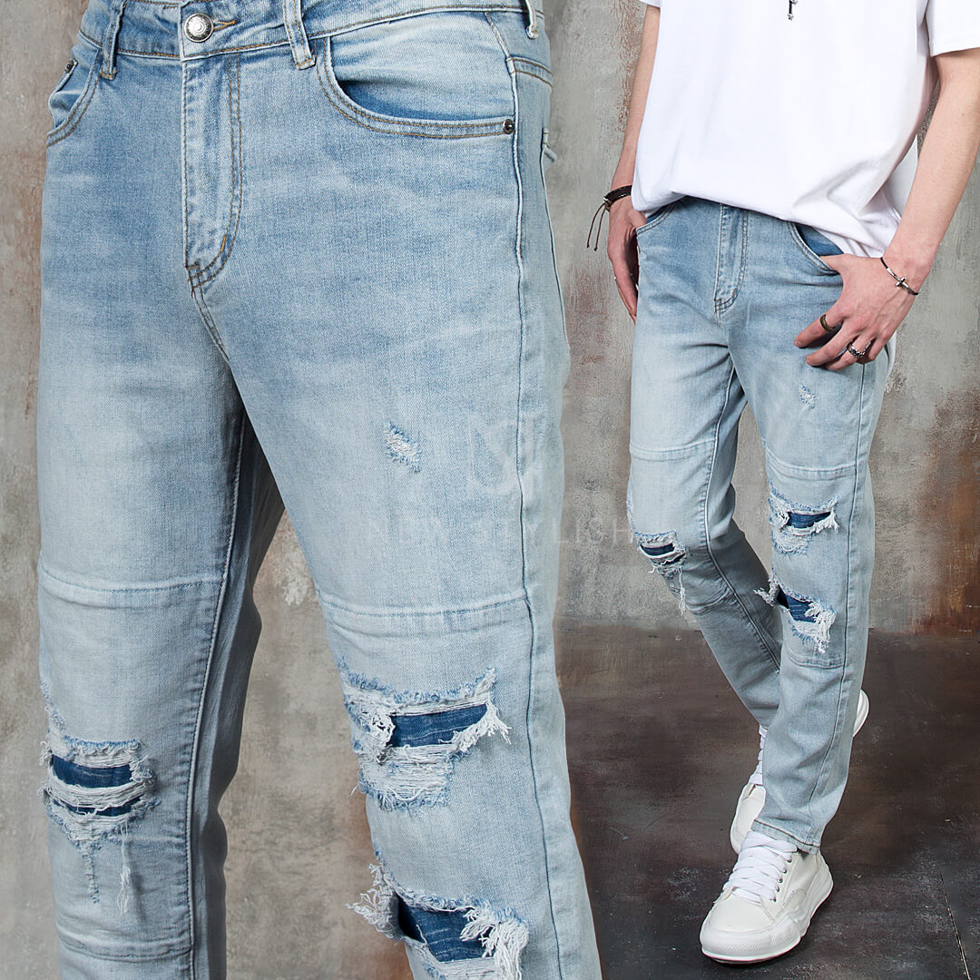 Distressed ripped layered washed denim jeans