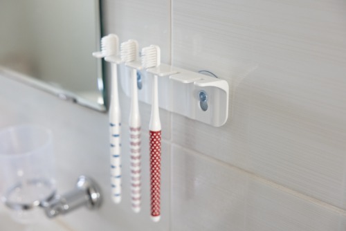 white toothbrush holder razor holder